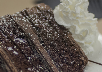 Chocolate fudge fantasy cake: three layers of chocolate cake, fudge middle, chocolate butter cream frosting