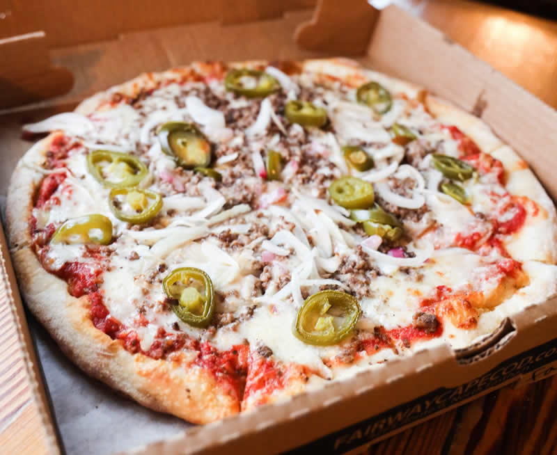 Specialty Fairway pizza with cheese, jalapenos and onion