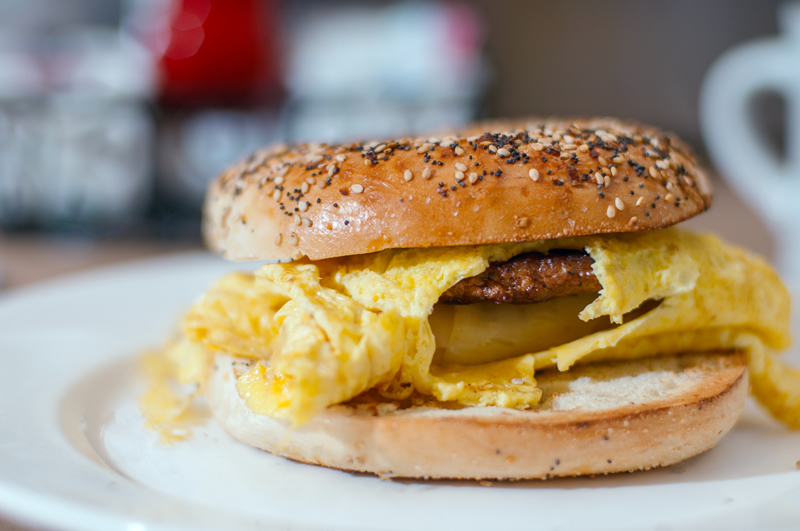 everything bagel sandwich with egg, cheese and sausage patty